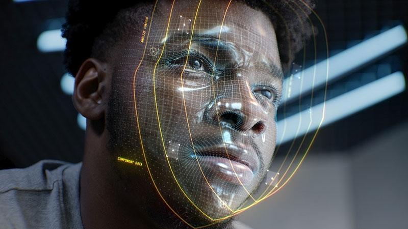Close up face portrait of young African American man with serious look. 3D animation of human futuristic AI virtual face scanning.