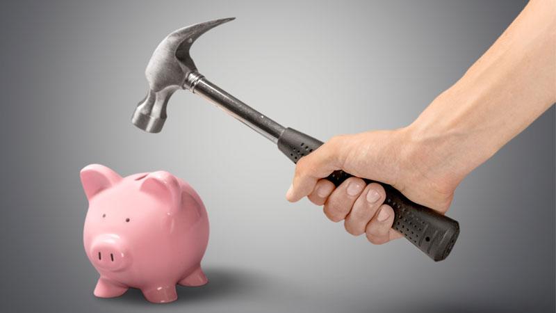 hammer about to break a piggy bank